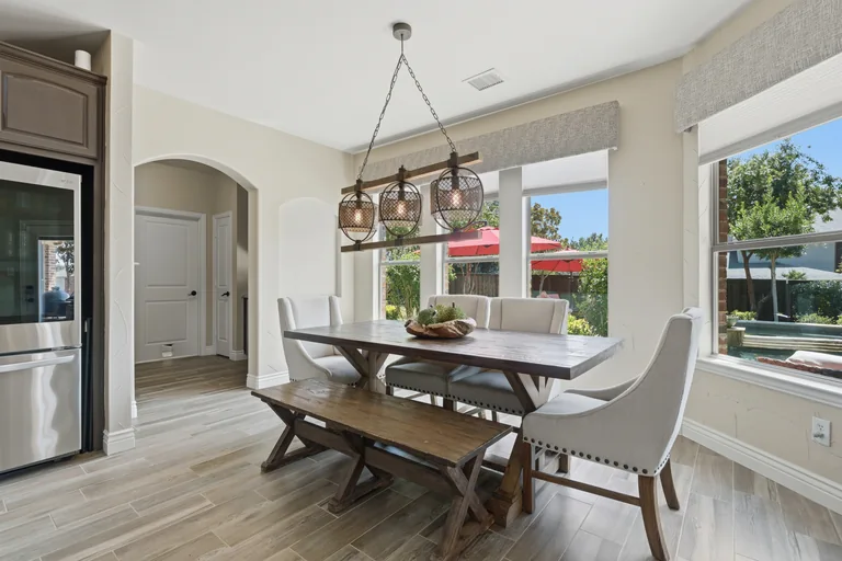 Breakfast area overlooking the patio and pool at 1000 Monticello Drive in Prosper