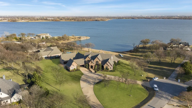 Aerial view of residences, lawns and a lake — FLM media library example