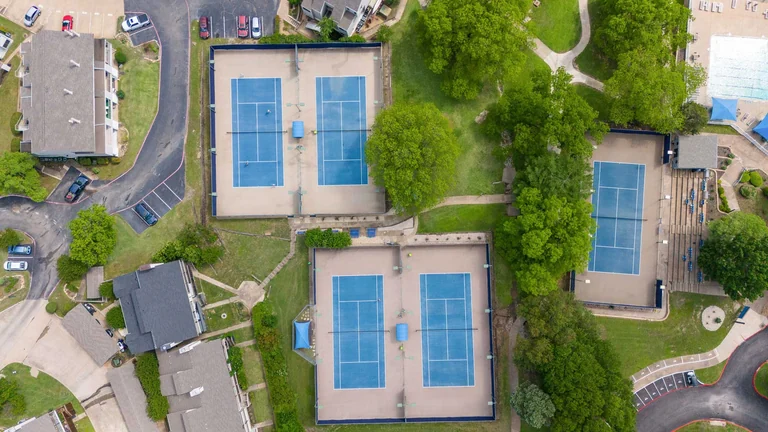 Aerial view of tennis courts and surrounding neighborhood — FLM media library example